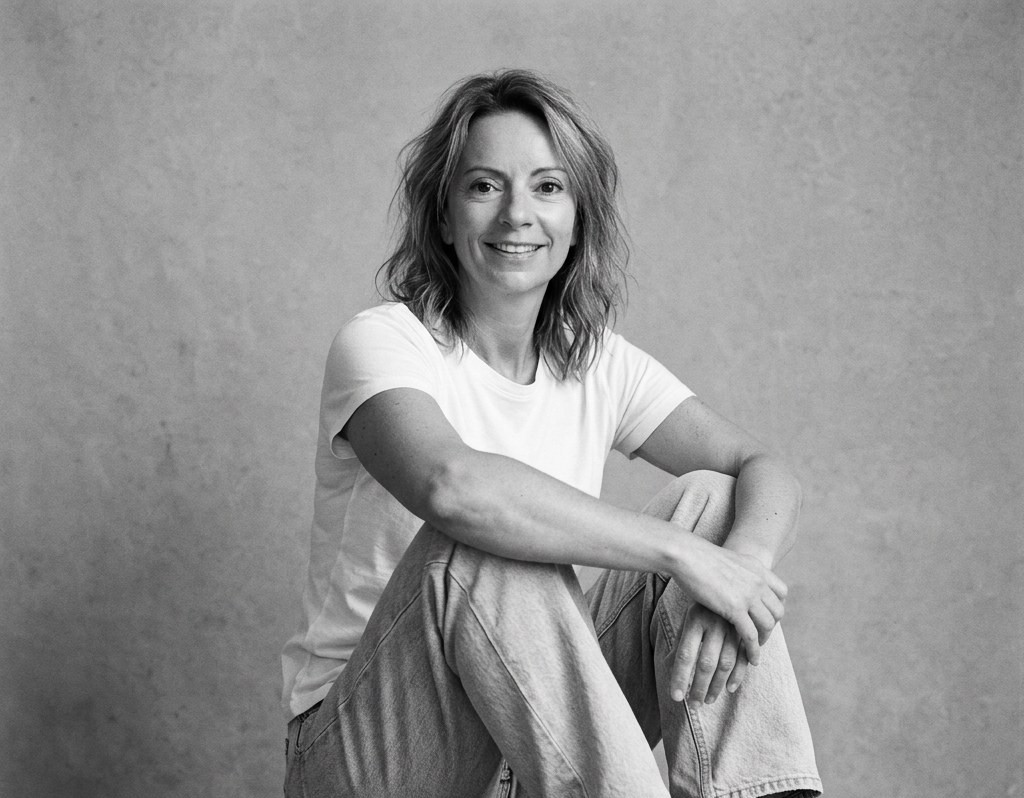 Portrait of Fiona Glen, founder of Soul Work Life Coaching, seated and smiling